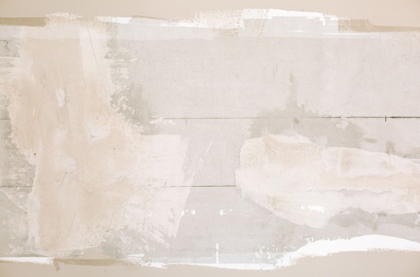 Drywall seams and patches covered with joint compound, not yet sanded